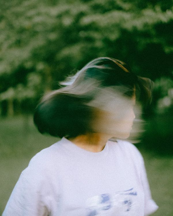 Woman performing a gentle dynamic exercise in a calm environment.
